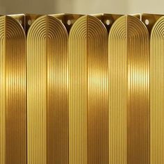 a gold radiator in front of a white wall