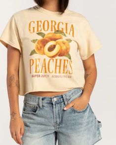 15+ Fabulous And Perfect Country Concert Outfits to Rock the Night In 2024 Peach Outfit, Peach Clothes, Country Concert Outfits, Black Cowgirl Boots, Hufflepuff Aesthetic, Peach Shirt, Black Skort, Tee Designs, White Bralette