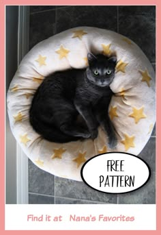 a black cat sitting on top of a bed with yellow stars and the caption free pattern find it at nana's favorites