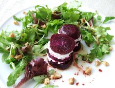 beet and goat cheese salad on a white plate