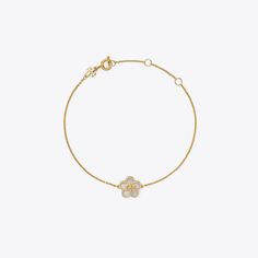 Featuring a mother-of-pearl flower and our signature Double T, the Kira Bracelet is perfect for every day. Elegant White Bracelets With Flower Charm, Elegant White Gold Bracelet With Flower Charm, Luxury Bracelet With Flower Charm, Elegant Yellow Gold Bracelets With Flower Charm, Elegant Mother Of Pearl Jewelry With Flower Charm, Elegant Yellow Gold Bracelet With Flower Charm, Luxury Flower Charm Jewelry, Luxury Gold Bracelets With Flower Shape, Luxury Flower-shaped Bracelets As Gift