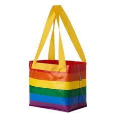 a rainbow colored tote bag is shown against a white background with the handles down