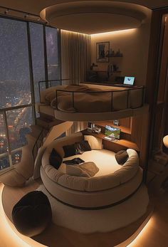 a room that has a spiral bed in the middle of it and a large window