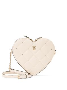 Love this for you. Our structured, heart-shaped crossbody is a flirty touch to your everyday style. 23" strap drop Shoulder-to-crossbody strap 8 1/4"L x 7 1/4"W x 2"H Partially made from recycled materials Fits: phone, wallet, keys, and lip gloss Heart Crossbody Bag, Pink Crossbody Bag, Heart Bag, Victoria Secret Bags, Glitz And Glam, Phone Wallet, Online Bags, Black Tote Bag, White Bag