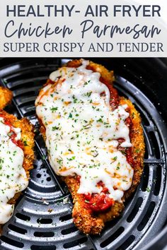 two pieces of chicken parmesan sitting on top of an air fryer