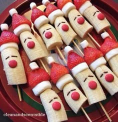 some strawberries with faces on them and marshmallows in the shape of people