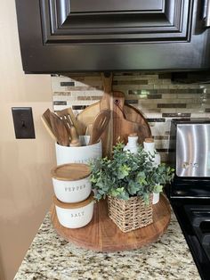 a kitchen counter topped with pots and pans