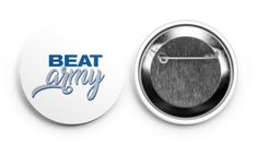 a button with the words beat sorry on it and an image of a tie pin