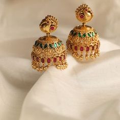 Description This timeless jhumki earring is perfectly crafted with polki stones on a gold-plated setting and finished with precious stones. An elegant wardrobe essential, these jhumki earrings will be your favorite. Style with the traditional accessories from the Vihara family for a grand look. This is the perfect choice for festival events and weddings. Product Information Metal: 925 Silver with 1.0 microns Antique Gold Plating Length: 4 cm Stones: Semi precious stones Findings: Screw back type 22k Gold Chandbali Jhumkas For Festive Occasions, Chandbali Cutdana Jhumkas For Reception, Festive Cutdana Jhumkas, Gold Bollywood Jhumkas For Reception, Festive Cutdana Jhumkas For Reception, Reception Chandbali Jhumkas With Cutdana, Temple Jewelry Kundan Jhumkas With Matching Earrings, Temple Jewelry Chandbali Jhumkas With Tilla, Gold Plated Temple Jewelry Jhumkas With Tilla