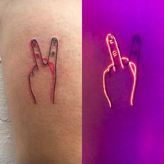 two different colored tattoos on the side of someone's thigh and one with a finger sign