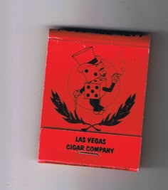 a red matchbox with a cartoon character on it