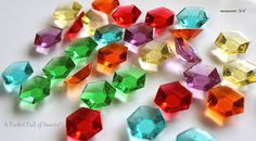 many different colored diamonds on a white surface