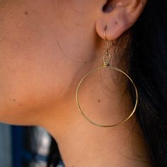 You won’t want to take these hoop earrings off - they are effortless, light and comfortable to wear all day and into the evening. These handmade earrings are perfect for everyday wear. This item is part of the “Hope Line” which consists of introductory pieces made by our new artisans, and tell a powerful story of fresh beginnings. The artisans first learn how to wrap while making these earrings! Included with your purchase of the brass Olivia Earrings will be a polishing cloth and instructions o