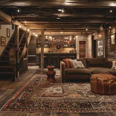 a living room filled with lots of furniture next to a stair case in a house