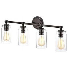 three light bathroom fixture with clear glass jars on the side and black metal arm,