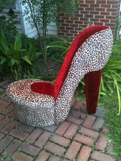 a leopard print high heeled shoe shaped chair