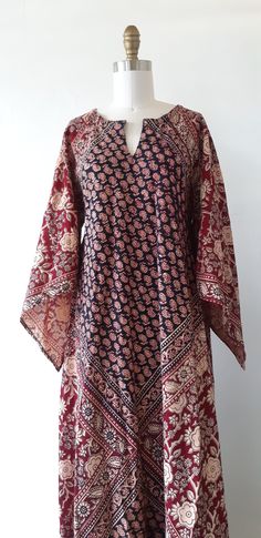 This vintage 1970s bohemian Indian cotton block print kaftan maxi dress is amazing! It features a gorgeous floral and graphic hand painted black and brown print, long angel bishop sleeves, a notch v-neckline and a full skirt. Fabulous!  ✂------ M E A S U R E M E N T S -------  best fit: fits most sizes  Dress bust: 41 inches waist free  hips: free sleeves: 27 1/2 inches Length: 59 inches tag/label - Union - RN59607 (FREE SIZE) - Wash in cold water with soap flakes, no detergent. Made in Pakistan material: cotton condition: Near mint, note this dress is not a gauze fabric / material. ★ Free Shipping - Processing, packaging and tracking are included. ★ Express shipping is available for U.S. & International orders for an additional cost! ★ Visit our shop at: https://www.etsy.com/shop/VivianVi 70s Bohemian, Block Print Dress, Brown Floral Print, Kaftan Maxi Dress, Cotton Kaftan, 70s Dress, Cable Knit Cardigan, Indian Cotton, Vintage Fabrics