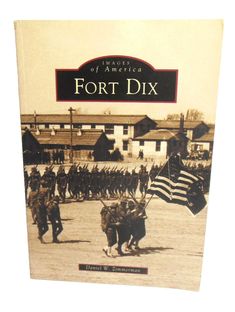 a book with an image of soldiers and horses in front of them, the title is fort dix