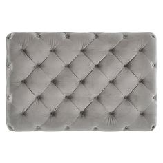 the grey velvet headboard with buttons on it is shown in front of a white background