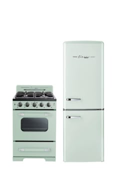 an old fashioned stove and refrigerator are next to each other on a white background,