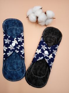 two pairs of slippers are next to cotton