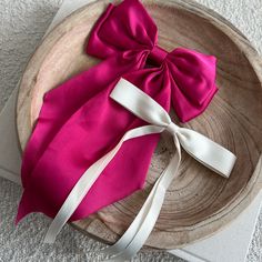 As the newest addition to our bow collection, the luxe silk bow does not disappoint. This oversized bow elevates and adds a pop to any holiday outfit. - Material: Satin - Size: 8.9(L) x 12.6(H) inches - Tight, clasping barrette closure - Designed with love in San Diego Shop the rest of our bow collection here FAQ click here Return Policy click here White Bow For Spring Party, Pink Party Bow With Bow Tie Back, Chic Satin Bow For Spring, White Spring Party Bow Tie, Formal Silk Decorative Bow, Formal Silk Satin Bow, Pink Bow Tie With Detachable Bow For Party, Pink Ribbon Bow For Spring, Chic Evening Bow With Detachable Feature