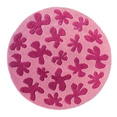 a round rug with pink flowers on it