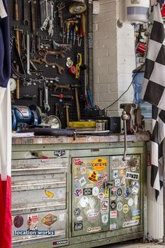 an old toolbox with lots of stickers on it