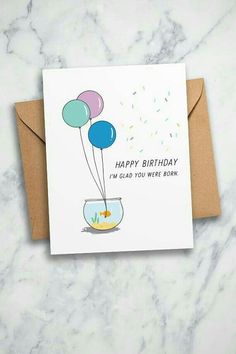 a birthday card with balloons floating in a fish bowl