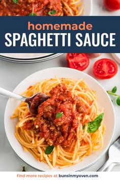 spaghetti sauce in a white bowl with tomatoes and basil on the side text overlay reads homemade spaghetti sauce