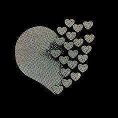 a heart made up of small hearts on a black background with the word love written in it