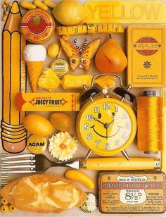 the yellow clock is surrounded by other items and things to make it look like they are made out of paper