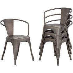 two metal chairs sitting next to each other