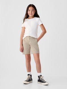 Made with 20% organically grown cotton.  Organic cotton is better for people and the environment because it's grown without the use of harmful synthetic pesticides and fertilizers.  Soft woven knit uniform midi shorts.  Button at center front Basic Cotton Shorts, Gap Cotton Shorts For Spring, Gap Relaxed Cotton Shorts, Gap Relaxed Fit Cotton Shorts, Gap Cotton Skort, Spring Organic Cotton Shorts, Gap Cotton Shorts, Casual Organic Cotton Short Bottoms, Kids Uniform