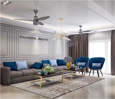 a living room with blue and grey furniture in the center, along with a ceiling fan