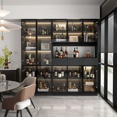 a room filled with lots of bottles and shelves next to a dining table in front of a window