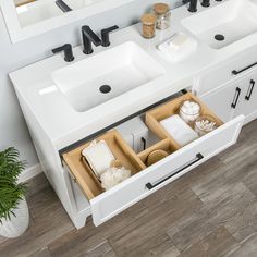 two sinks in a bathroom under a mirror