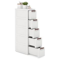 a tall white storage unit with five drawers and three bins on the bottom shelf