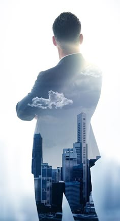 a man standing in front of a city skyline