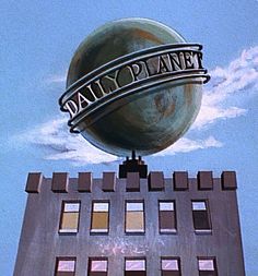 the sign for daiop planet is on top of a building with a fence around it