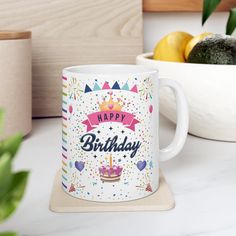 a happy birthday mug sitting on top of a counter