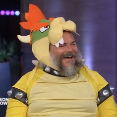 a man in a yellow costume with an angry bird on his head