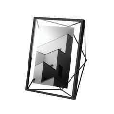 a black and white photo of a mirror with geometric shapes in the middle, against a white background