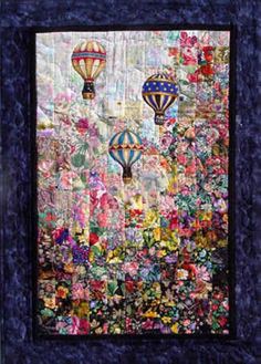 a quilted wall hanging with hot air balloons