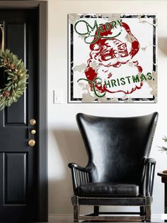 a chair sitting in front of a black door with a merry christmas sign on it