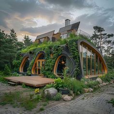 an unusual house with plants growing on it