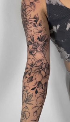 a woman's arm with flowers on it