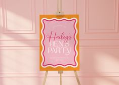 a pink and yellow sign with the words hen's party on it