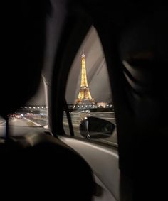 the eiffel tower seen from inside a car