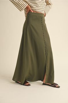 Get ready to turn heads in our Button Detail Satin Skirt! Made from luxurious satin material, it features unique button details for a fun twist. This skirt is perfect for adding a touch of playfulness to any outfit, while also keeping you looking chic and fashionable. Nomad Clothing, Button Outfit, Formal Dress Shops, Black Dress Formal, Athleisure Wear, Loungewear Sets, Satin Skirt, Satin Material, Sweater Sale